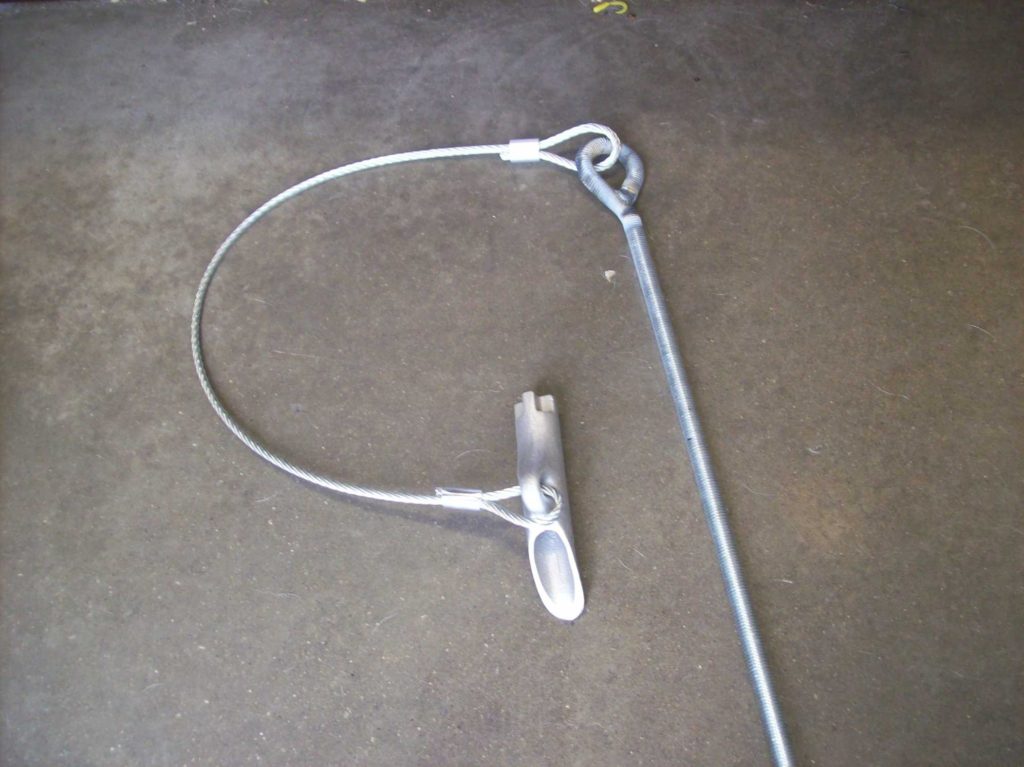 Embankment control anchor for retaining walls